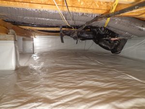 Crawl space encapsulation in Indiana with sealed floor liner and insulated HVAC ductwork