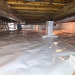 Crawl space encapsulation completed in Pittsboro, IN featuring a sealed white vapor barrier for long-term moisture control and mold prevention.