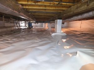 Crawl space encapsulation completed in Pittsboro, IN featuring a sealed white vapor barrier for long-term moisture control and mold prevention.
