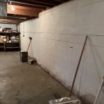 Interior view of a concrete block basement foundation wall in need of structural inspection in Indianapolis.